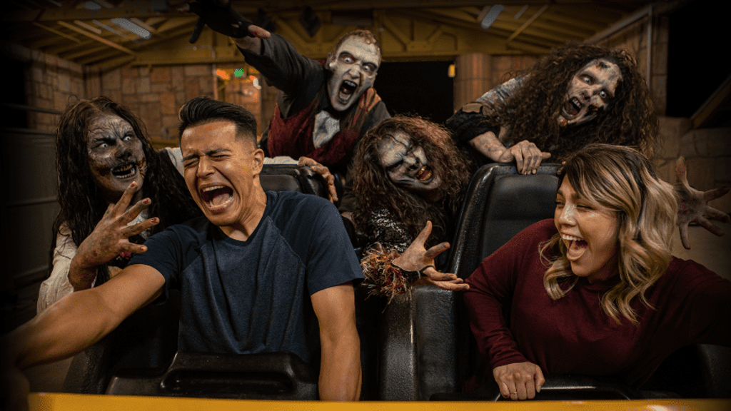 guests with scareactors on roller coaster