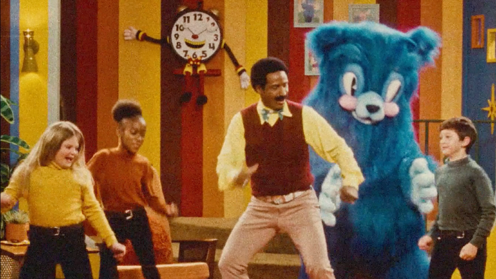 Mr Crocket movie still with kids dancing on stage