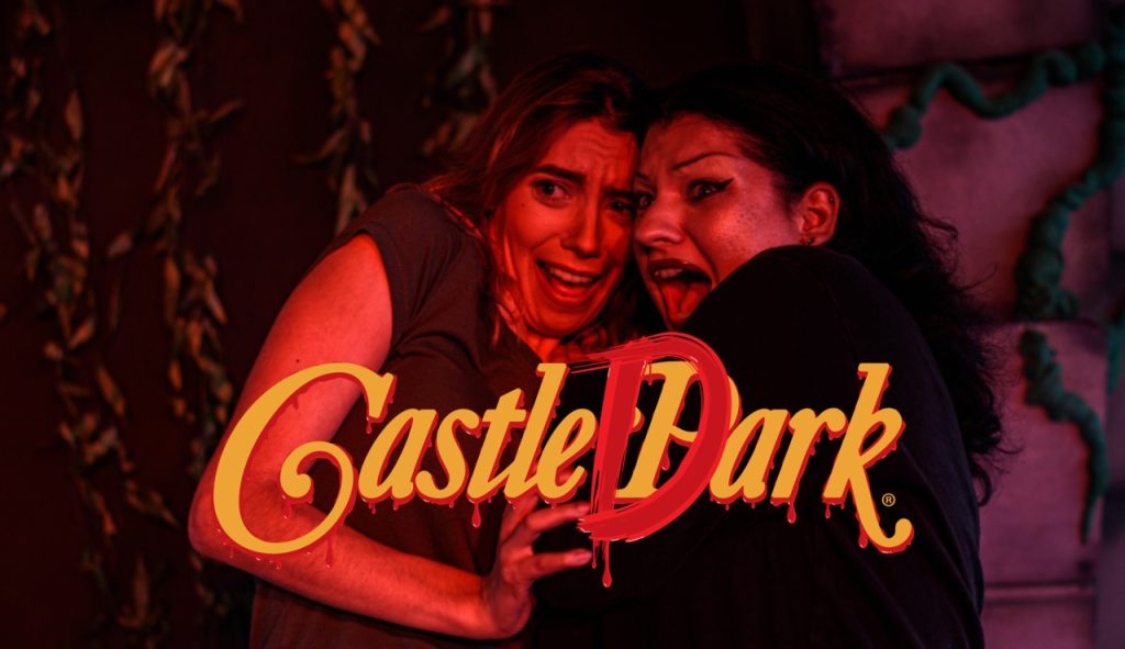 2 scared guests with castle dark logo overlayed