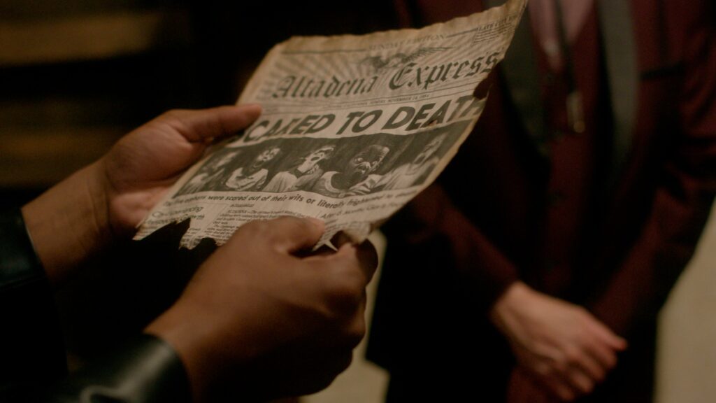 movie still from Scared to Death depicting someone holding a newspaper with the headline 'Scared to Death'