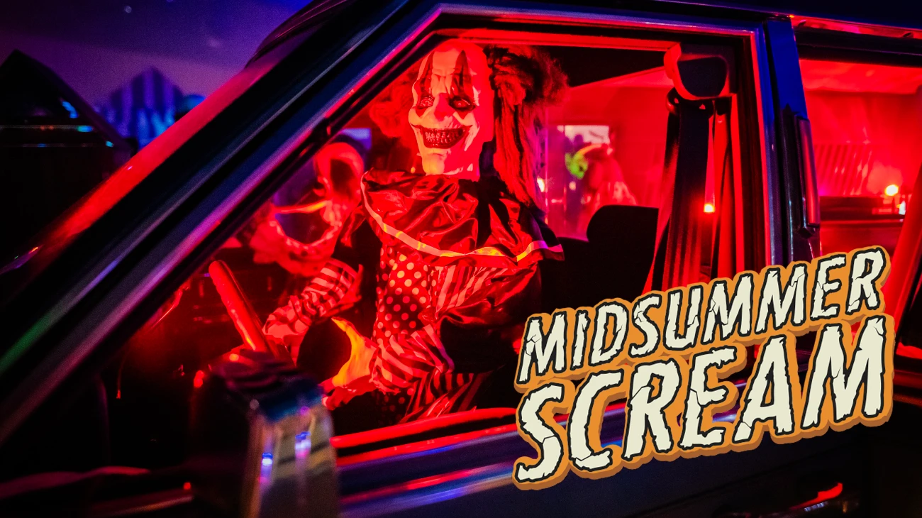 Midsummer Scream logo on image of creepy clown doll in car.