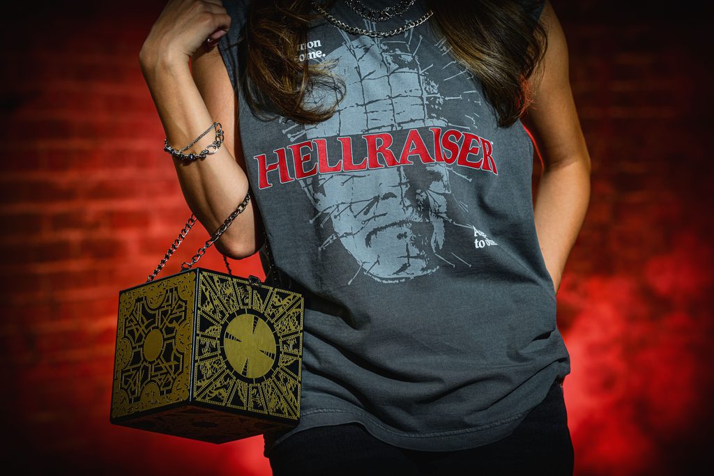 close up of Hellraiser tank top and purse on model.